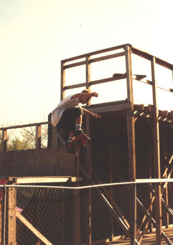 Montesi ollies from mini-ramp platform over the fence
