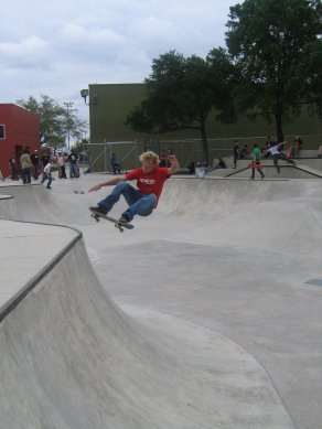 Unknown floats big hip ollie at LBJ Skatepark in San Antonio, TX @ March 2004