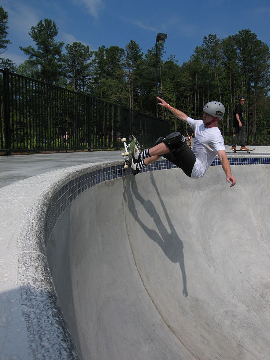 Zack destroying coping in a frontside manner