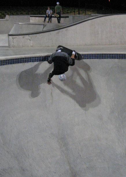 Woody works on handplants up the wall