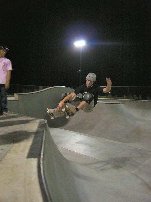 Zachary Reed floats a nice ollie grab over the flow bowl hip