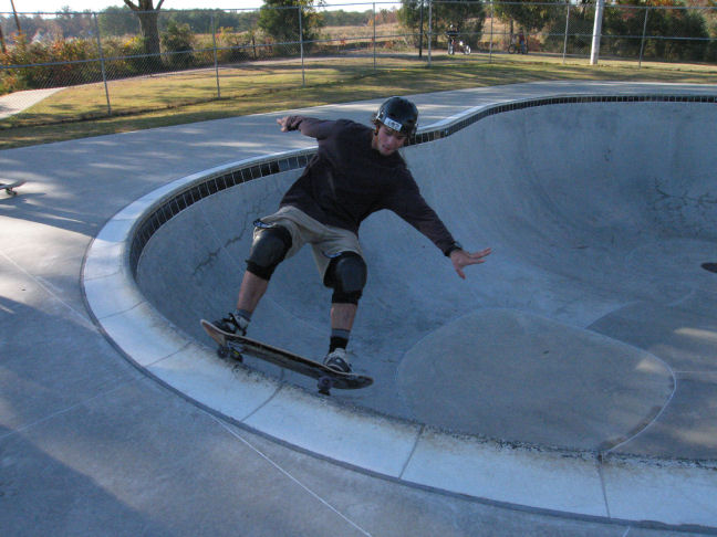 Danny warms up the coping in the shallow end